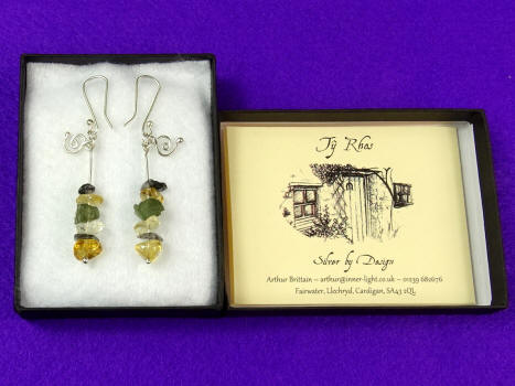 Earings in display box Earings in display box with information card
